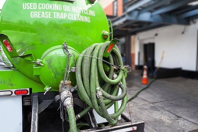 a grease trap pumping truck at a restaurant in Danville, AL